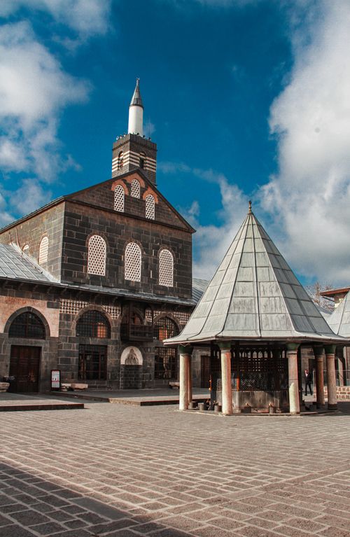 Free The historic Grand Mosque of Diyarbakır stands majestically under a bright blue sky in Türkiye. Stock Photo