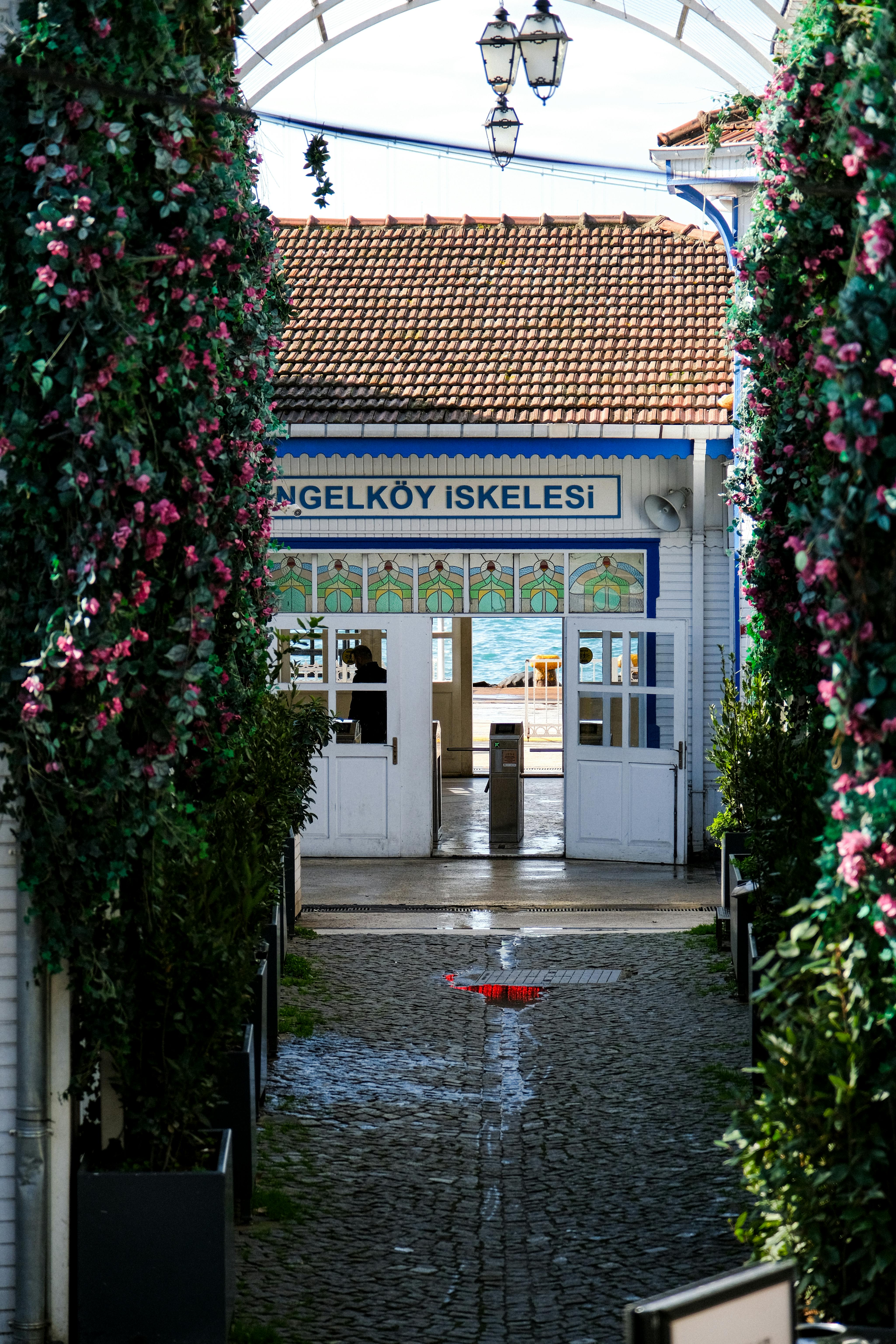 Picturesque view of Çengelköy Pier with floral archway in Istanbul.