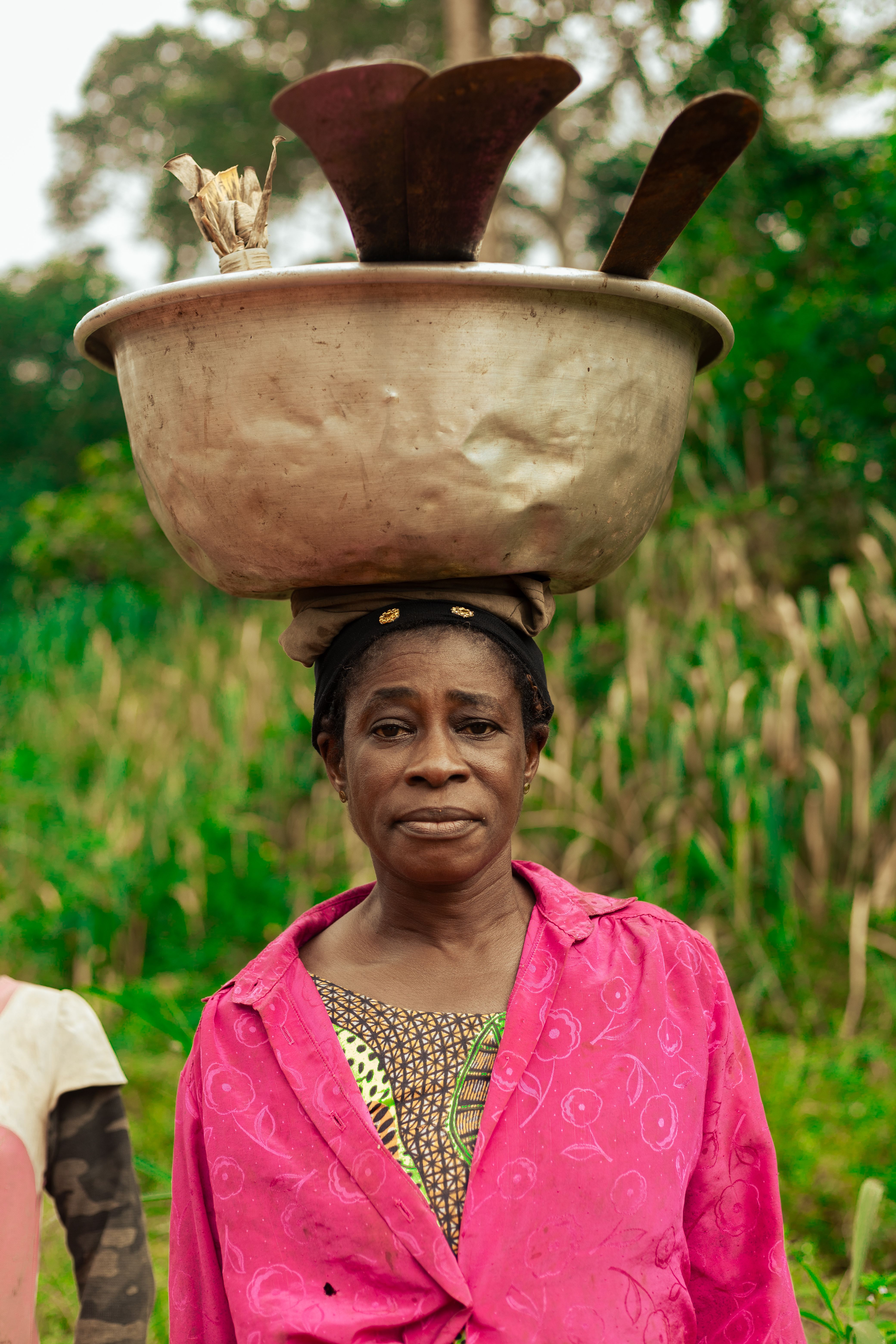 African Woman Balancing Bowl Outdoors · Free Stock Photo