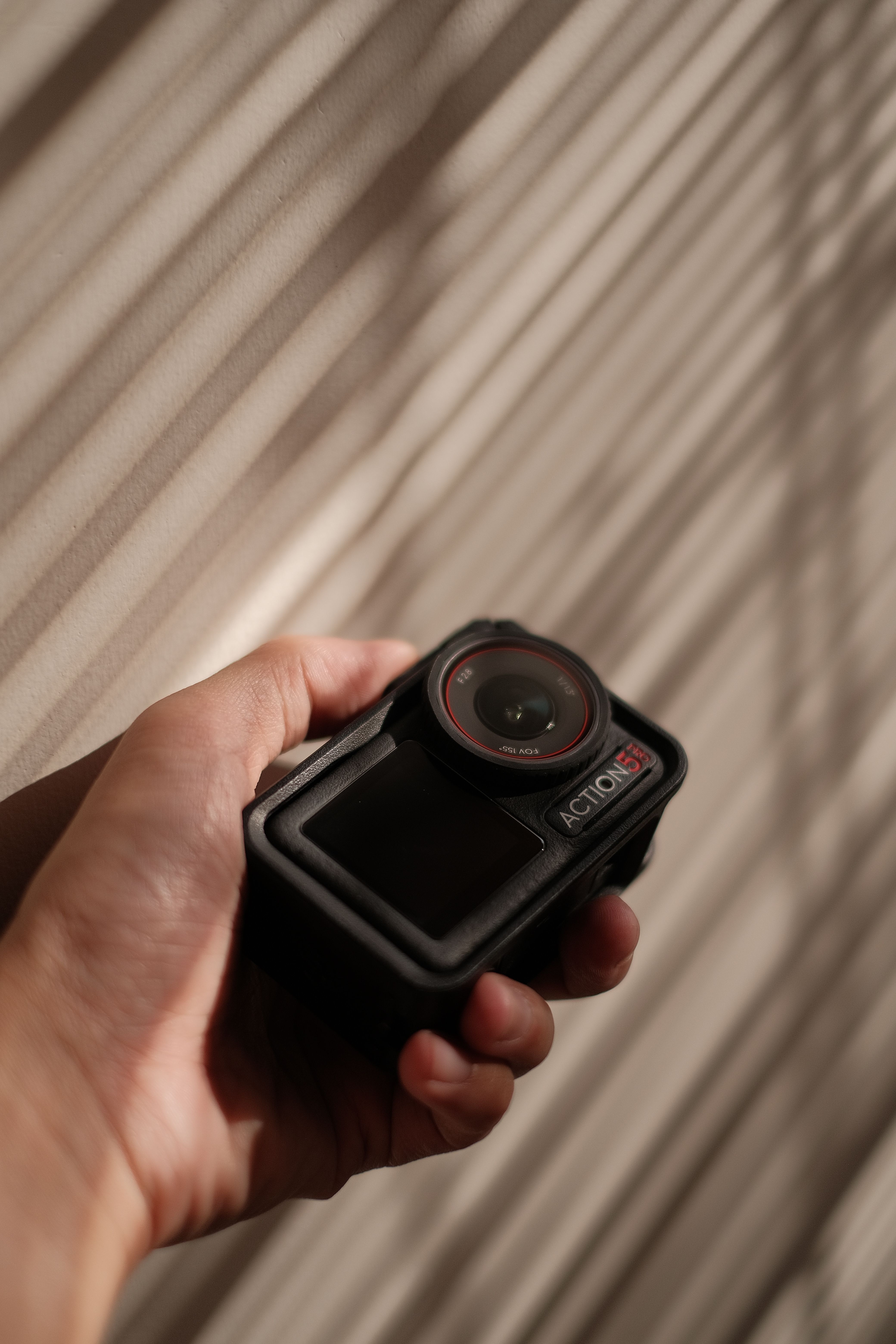 Hand Holding Action Camera with Shadows · Free Stock Photo