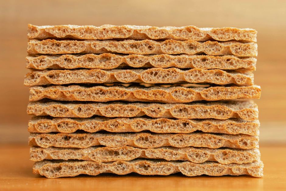 Close-up of stacked whole grain crispbread, perfect for healthy snacks and diet plans.