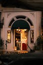 Charming Cafe Entrance at Dusk with Warm Lighting