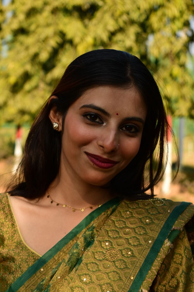 Smiling Woman in Traditional Indian Attire Outdoors · Free Stock Photo