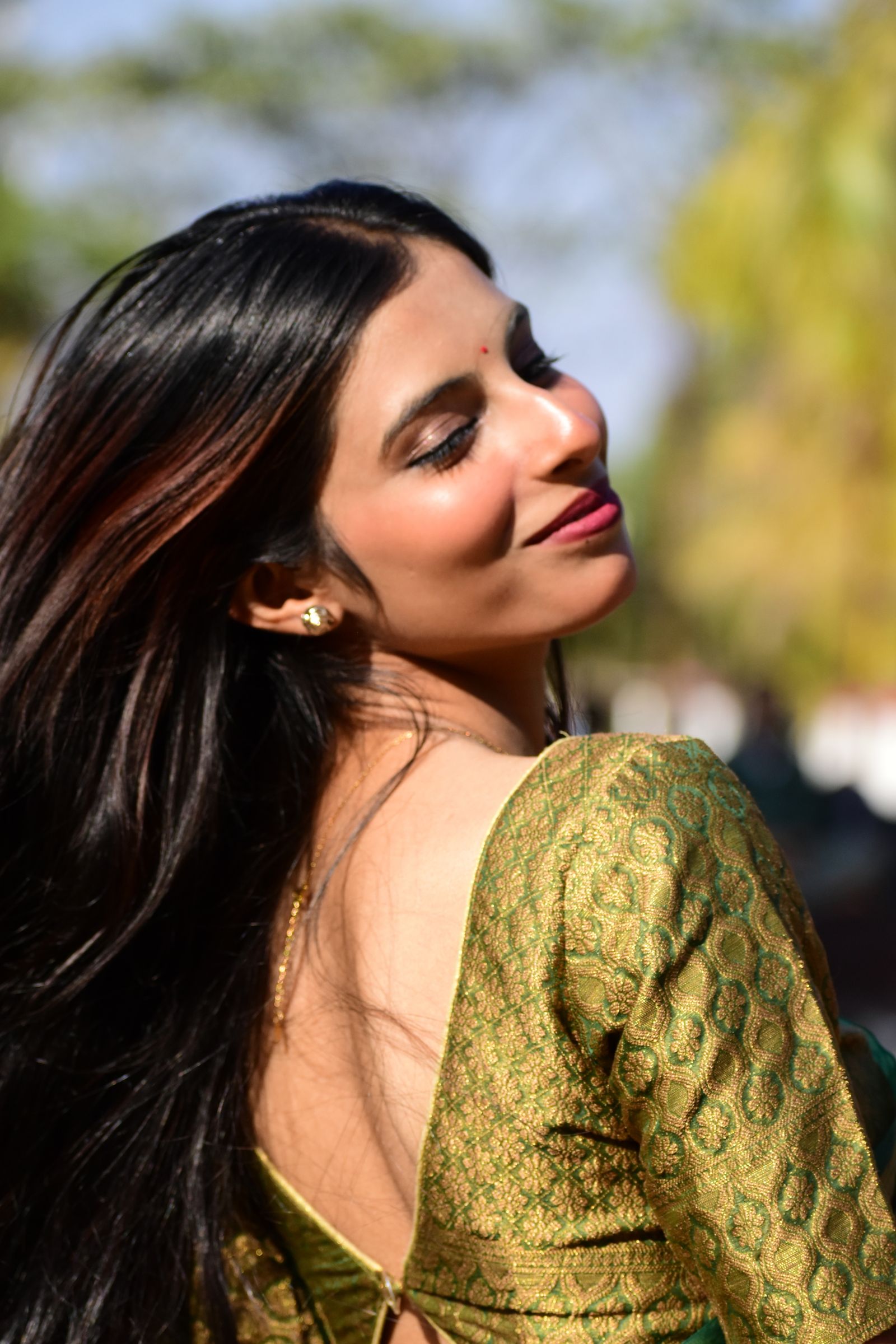 Smiling Woman in Traditional Indian Attire Outdoors · Free Stock Photo