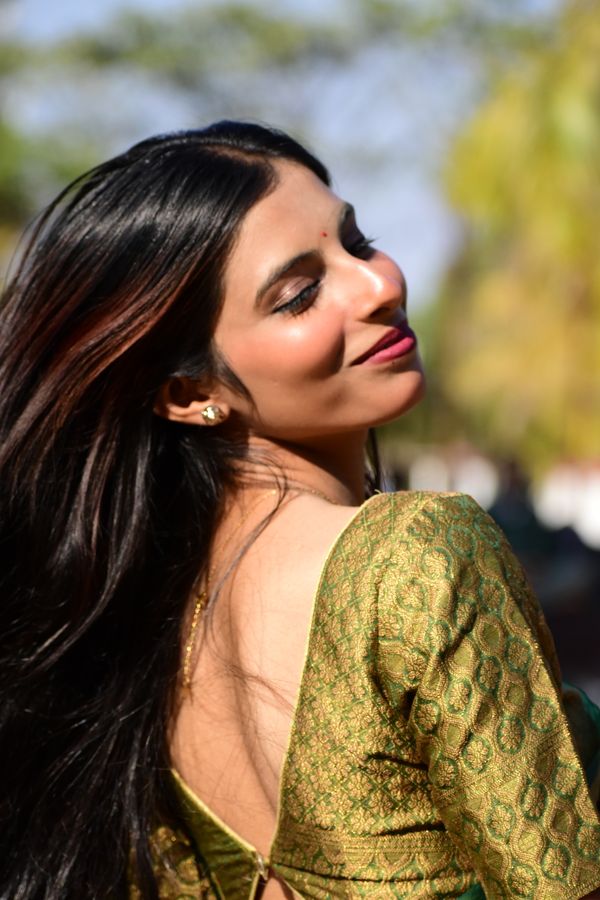 Smiling Woman in Traditional Indian Attire Outdoors · Free Stock Photo