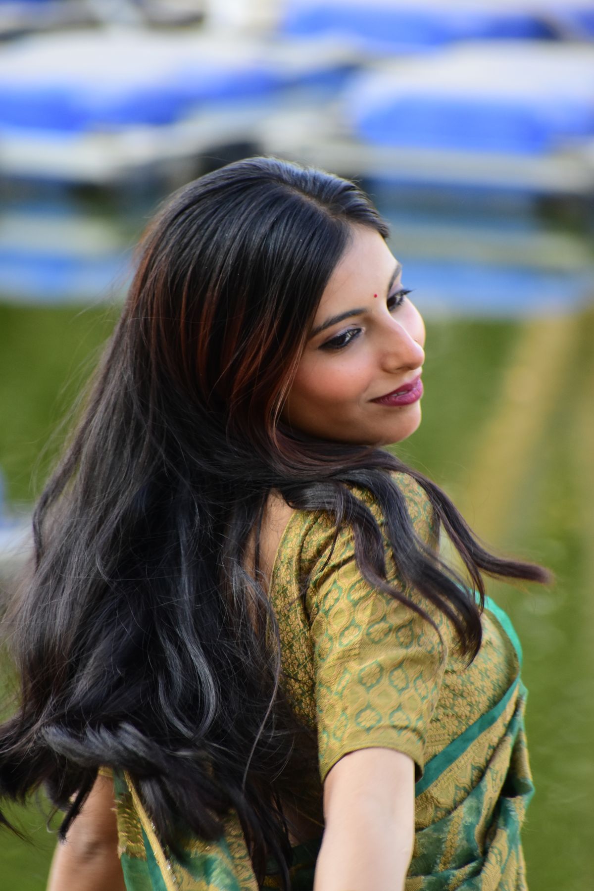 Smiling Woman in Traditional Indian Attire Outdoors · Free Stock Photo