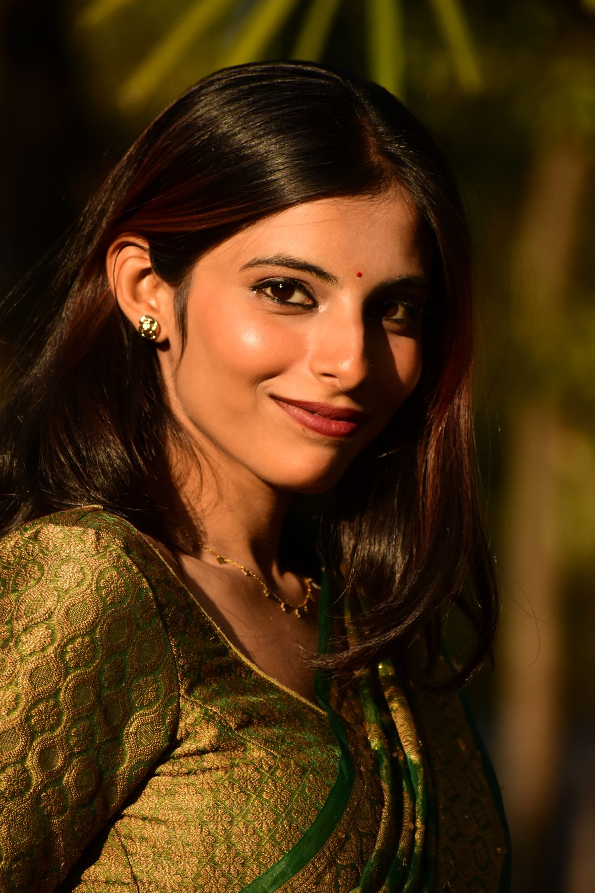 Smiling Woman in Traditional Indian Attire Outdoors · Free Stock Photo