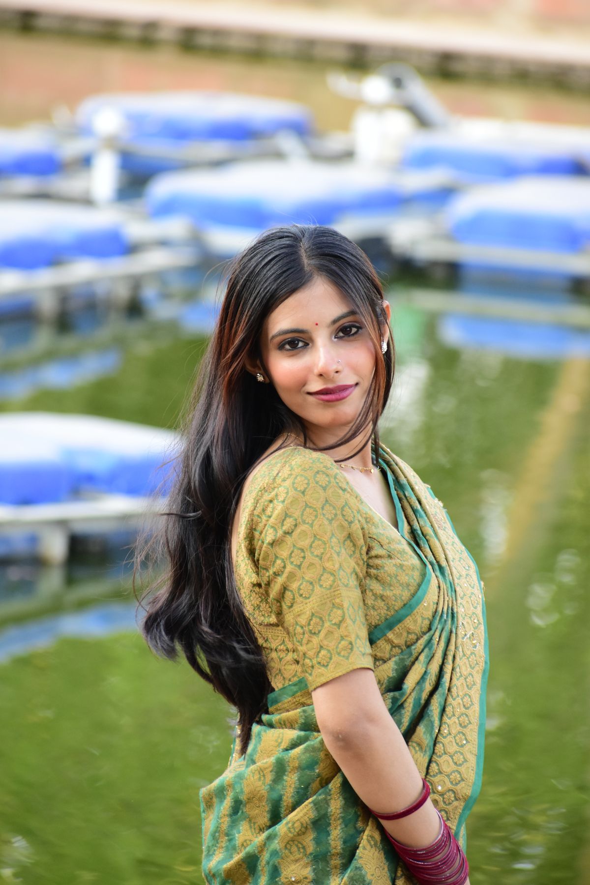 Smiling Woman in Traditional Indian Attire Outdoors · Free Stock Photo