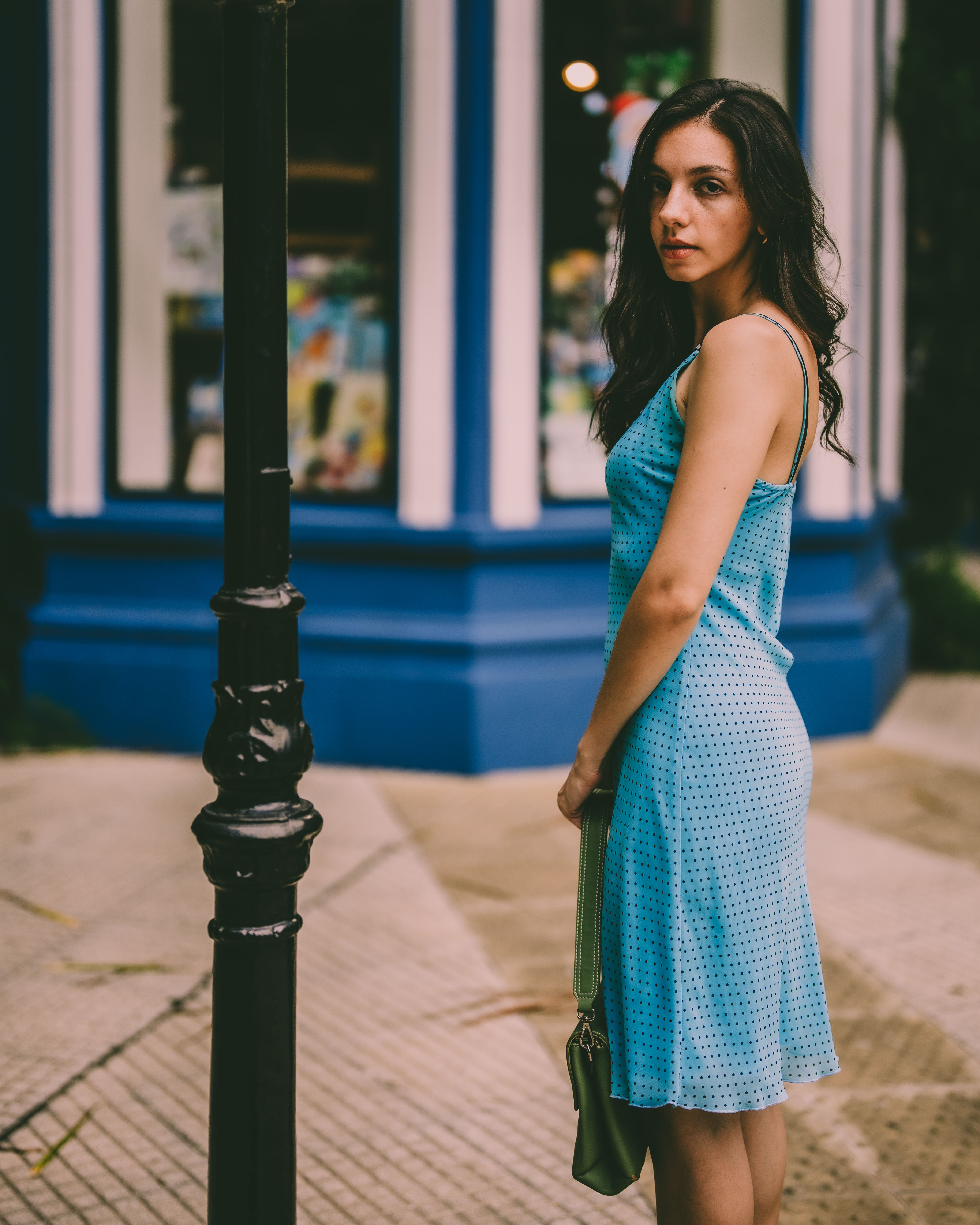 Elegant Woman in Blue Dress on City Street · Free Stock Photo