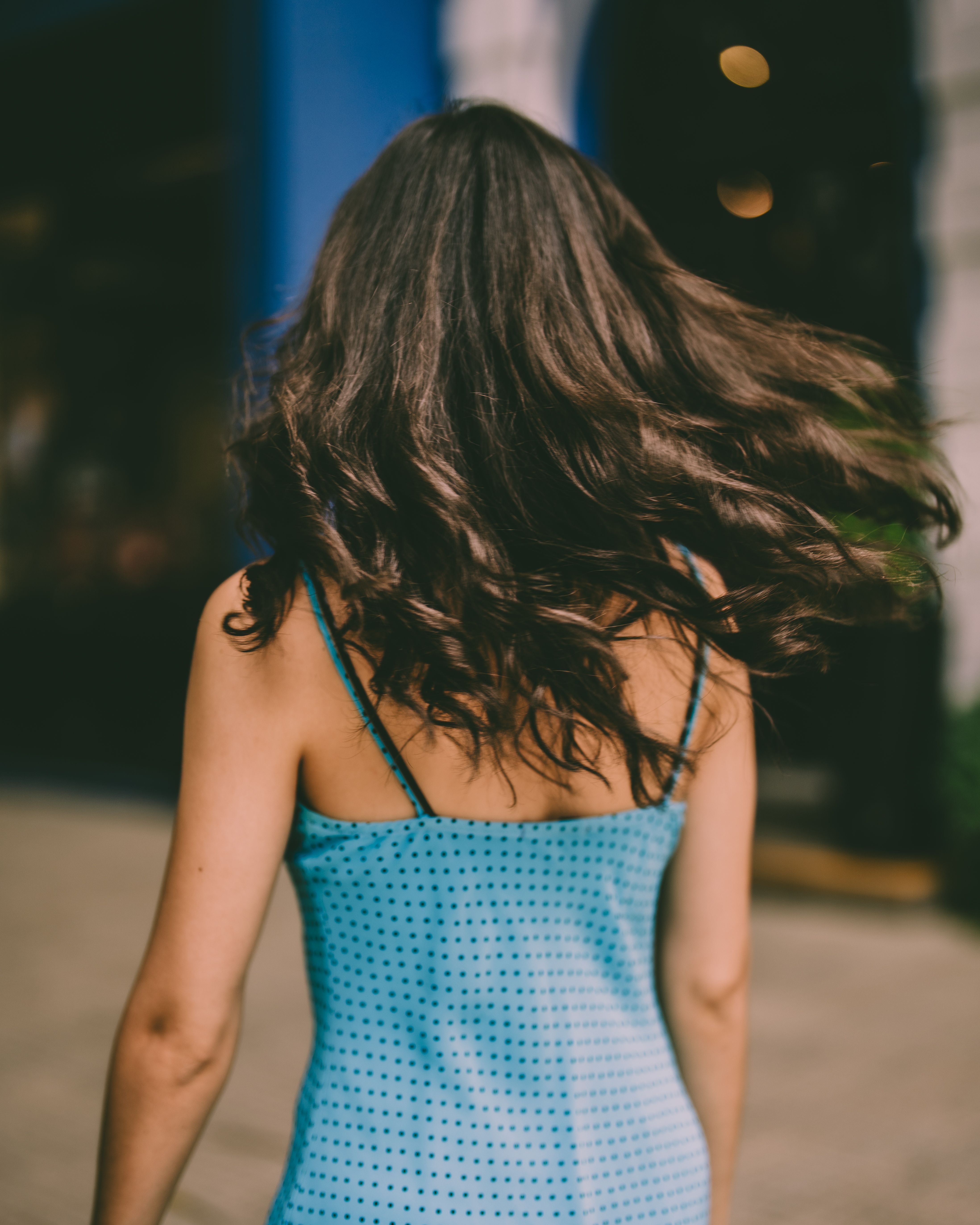 Woman in Blue Dress Walking Outdoors · Free Stock Photo