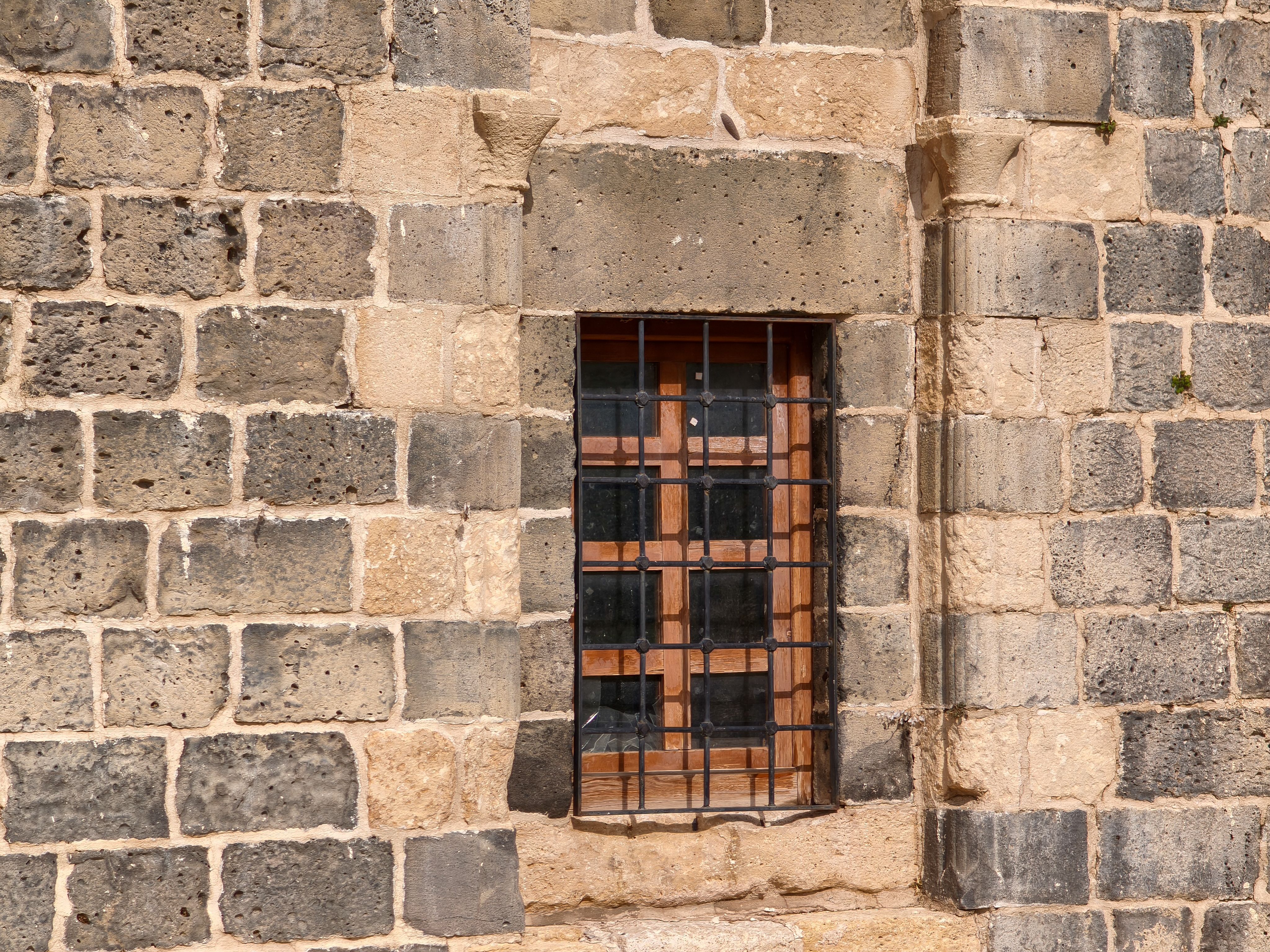 Historic Stone Wall with Barred Window in Türkiye · Free Stock Photo