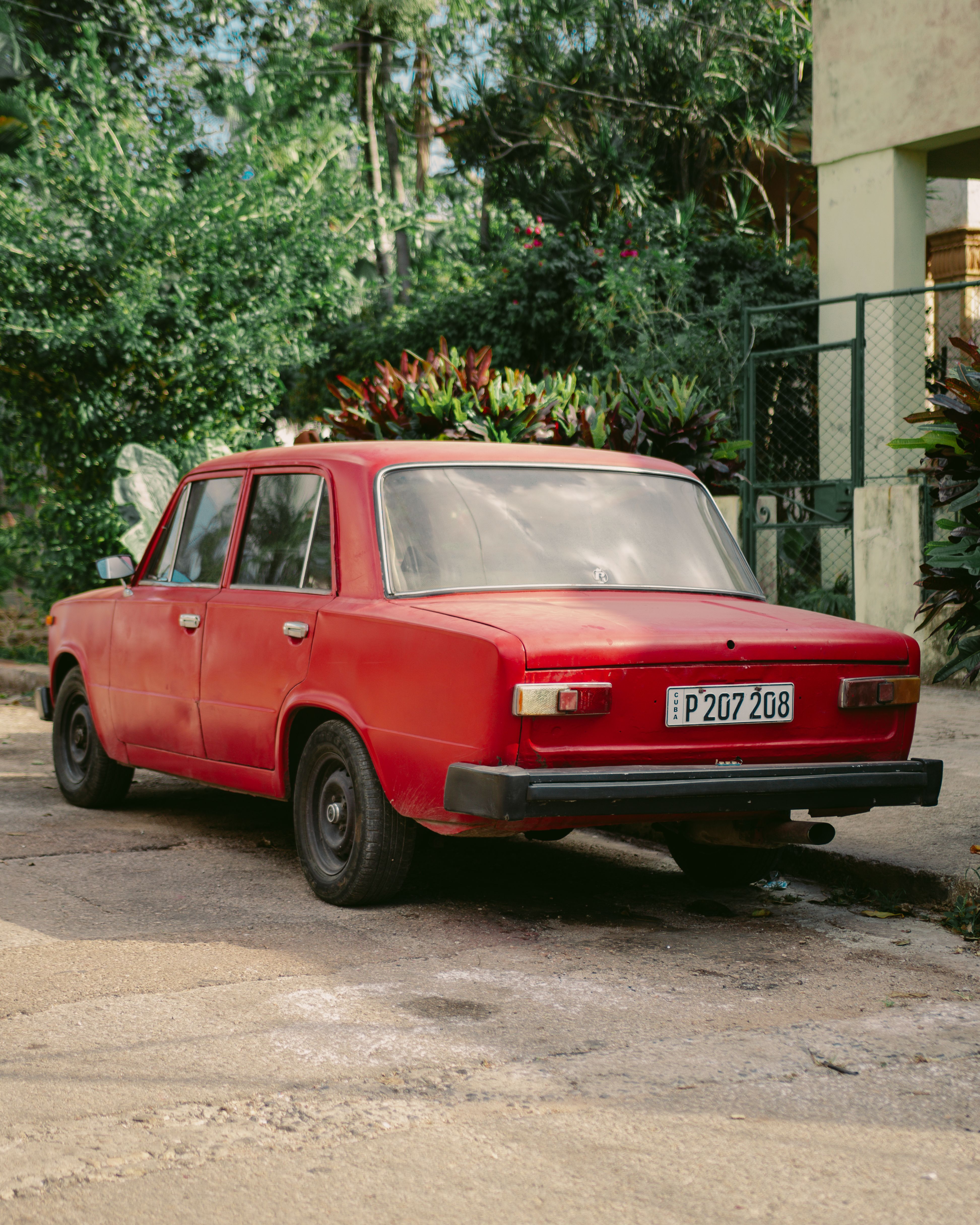 Vintage Red Car Parked on Urban Street · Free Stock Photo