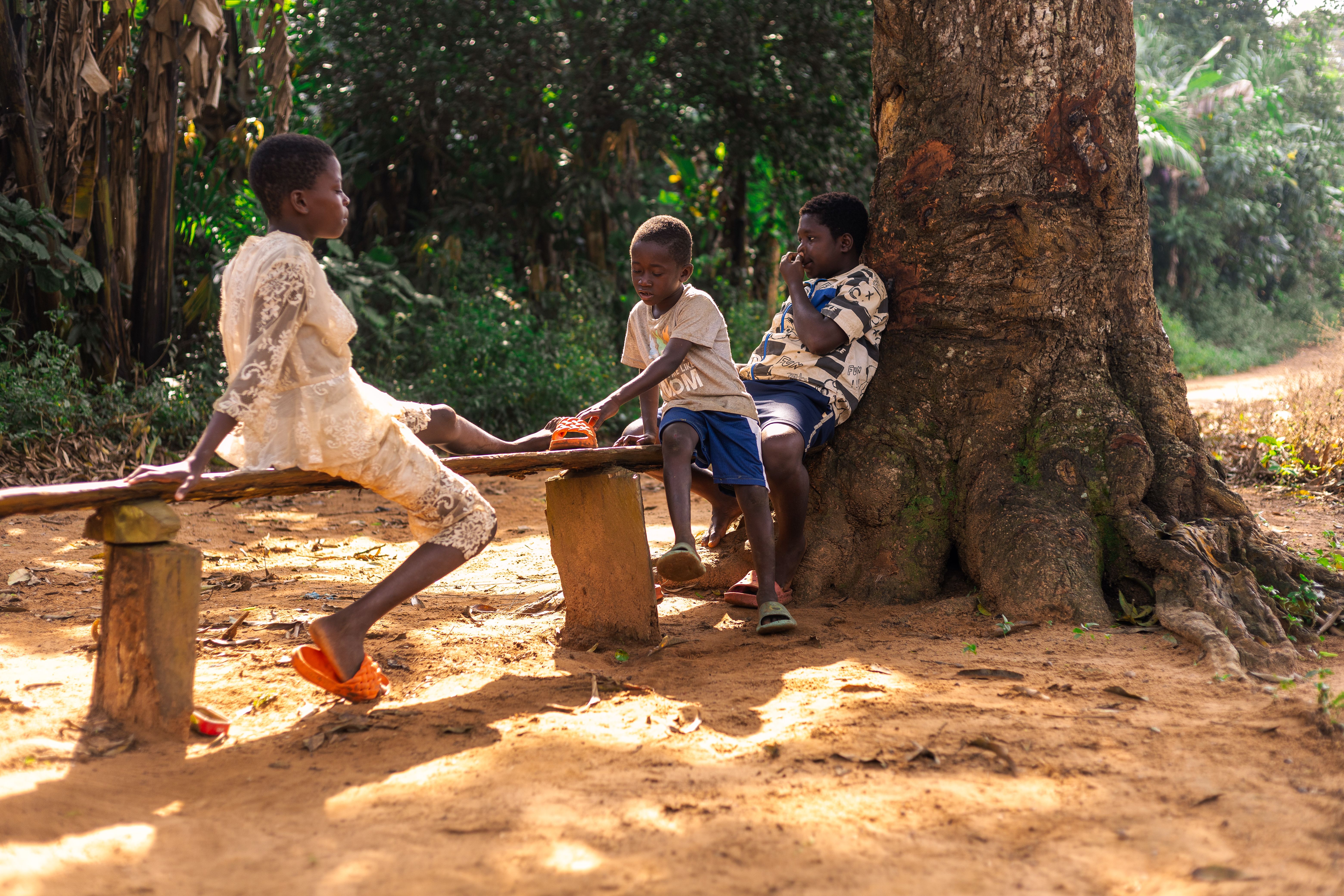 Children Playing Outdoors in Natural Setting · Free Stock Photo