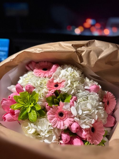 Free A beautiful bouquet with pink gerbera daisies and white hydrangeas, perfect for any occasion. Stock Photo