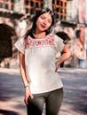 Young Woman in Embroidered Top Outdoors