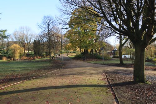 Free A serene pathway lined with trees in an English park during autumn, showcasing nature's beauty. Stock Photo