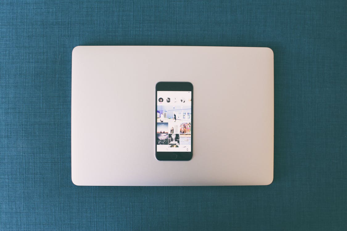Free Space Gray Iphone 6 on Macbook Stock Photo