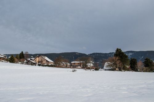 Free Idyllic winter landscape with snow-covered fields in Autrans-Méaudre-en-Vercors, France. Stock Photo