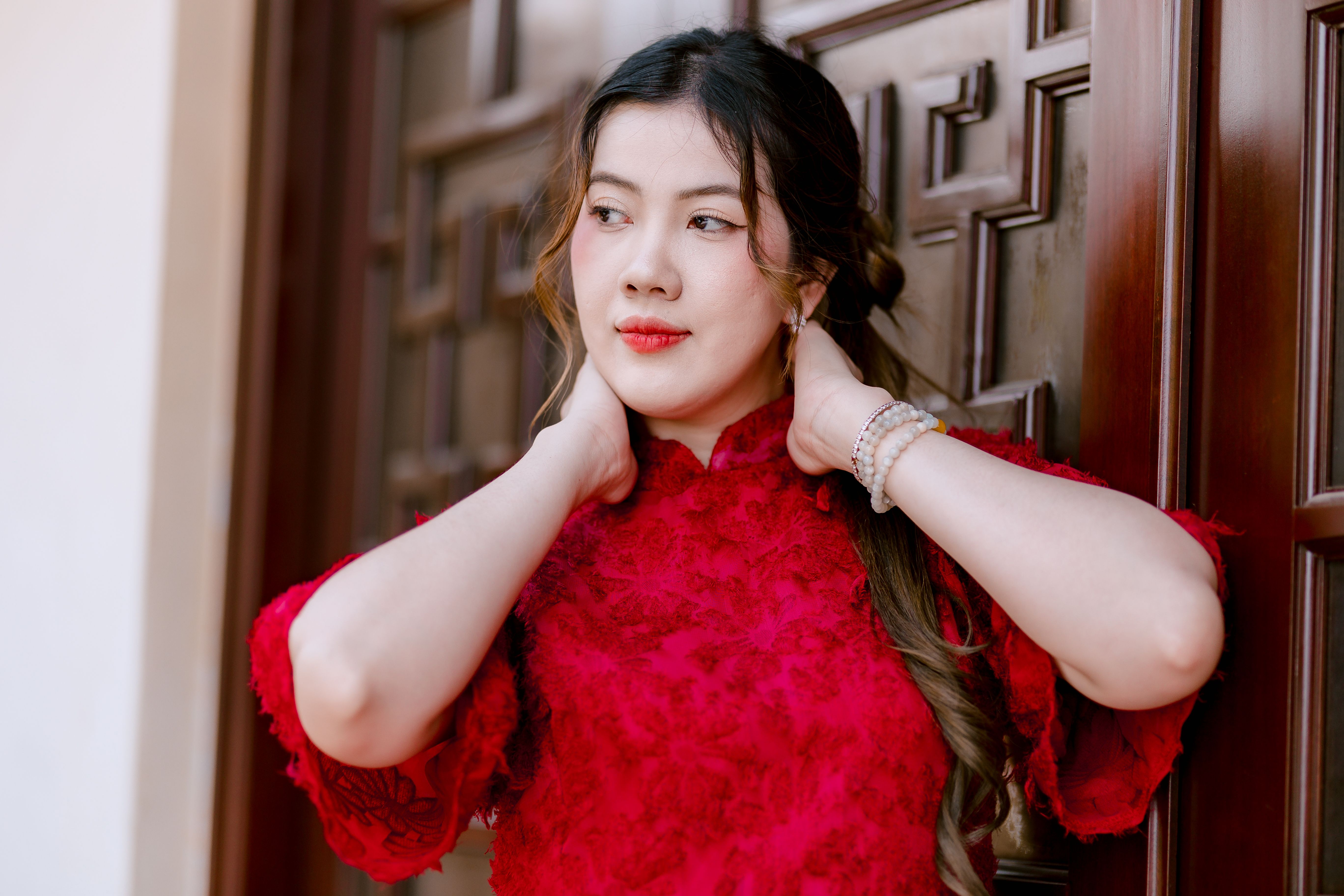 Woman in Traditional Red Dress by Wooden Door · Free Stock Photo