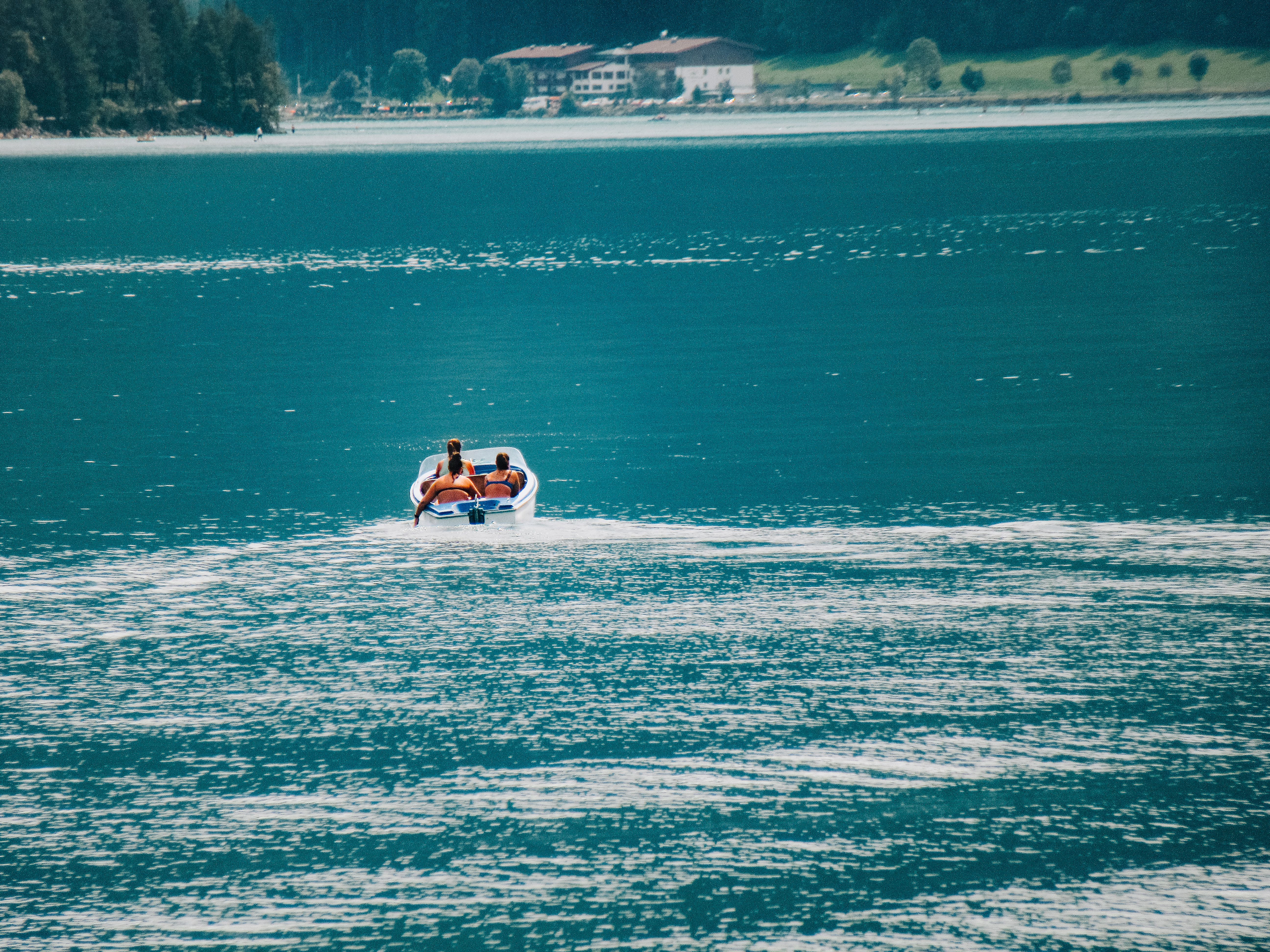 Relaxing Paddle Boat Ride on Serene Lake Waters · Free Stock Photo