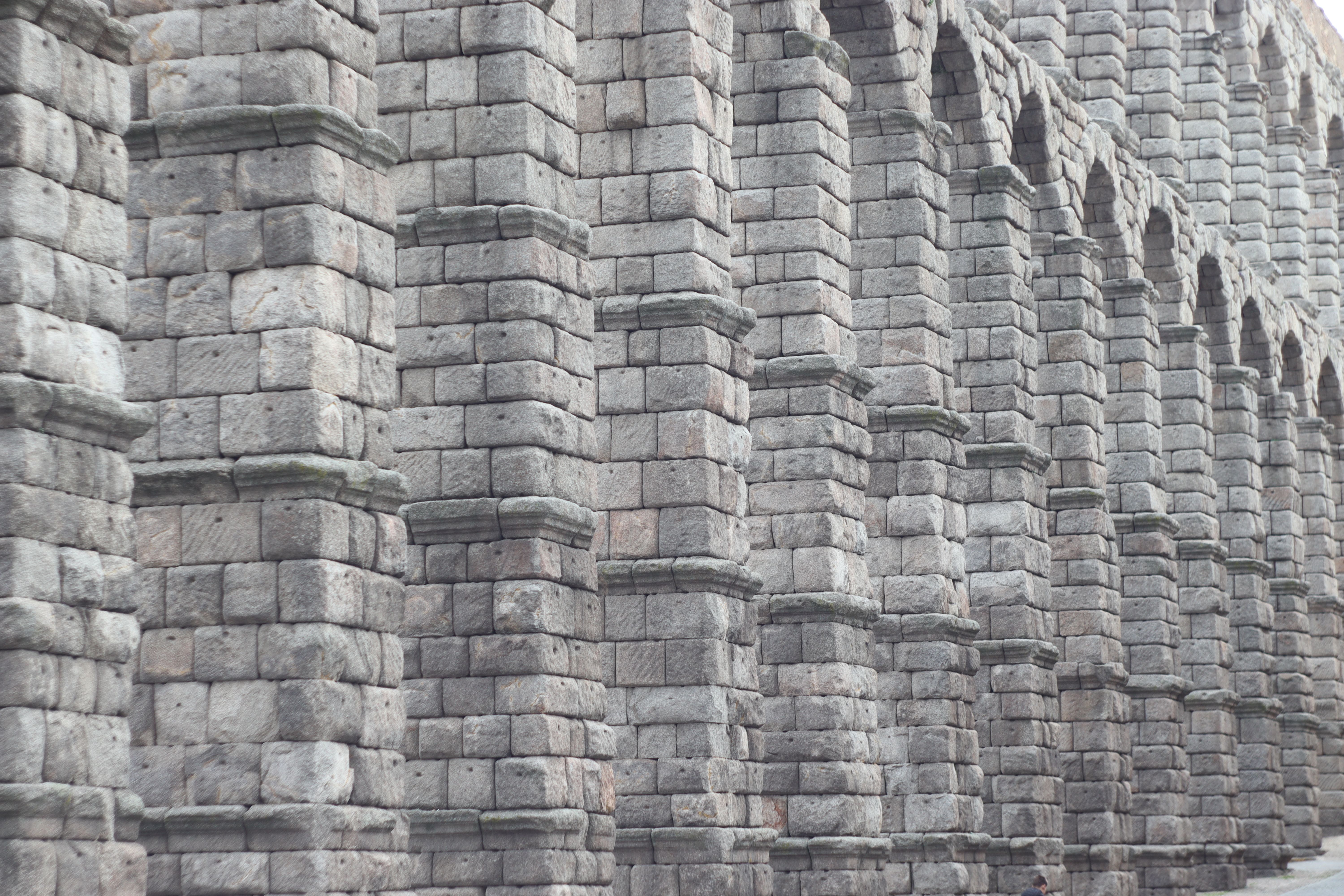 Morning light on the Roman aqueduct arches above the Plaza del Azoguejo in Segovia