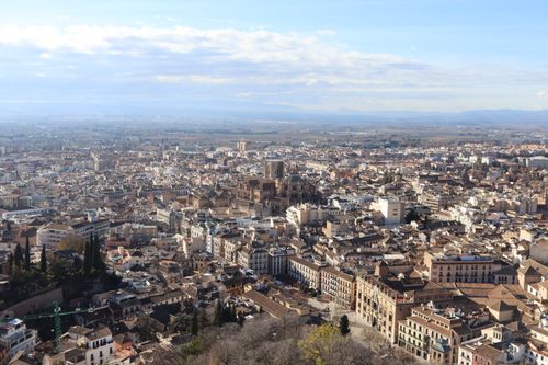 Free Stunning aerial view of Granada's historic cityscape with the Alhambra in Andalusia, Spain. Stock Photo