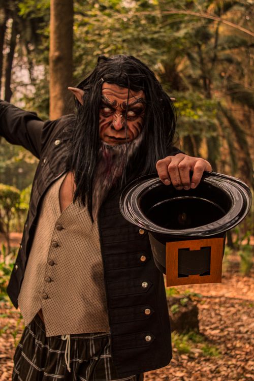Free Portrait of a fantasy elf character with theatrical makeup in a forest. Stock Photo