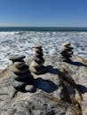 Balanced Beach Stones with Ocean Background