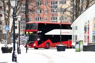 Red Double-Decker Bus in Snowy Jönköping