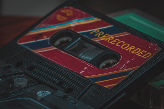 A detailed shot of a vintage prerecorded cassette tape with a retro design, capturing nostalgia.