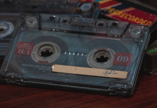Close-up of a classic audio cassette, showcasing analog nostalgia.