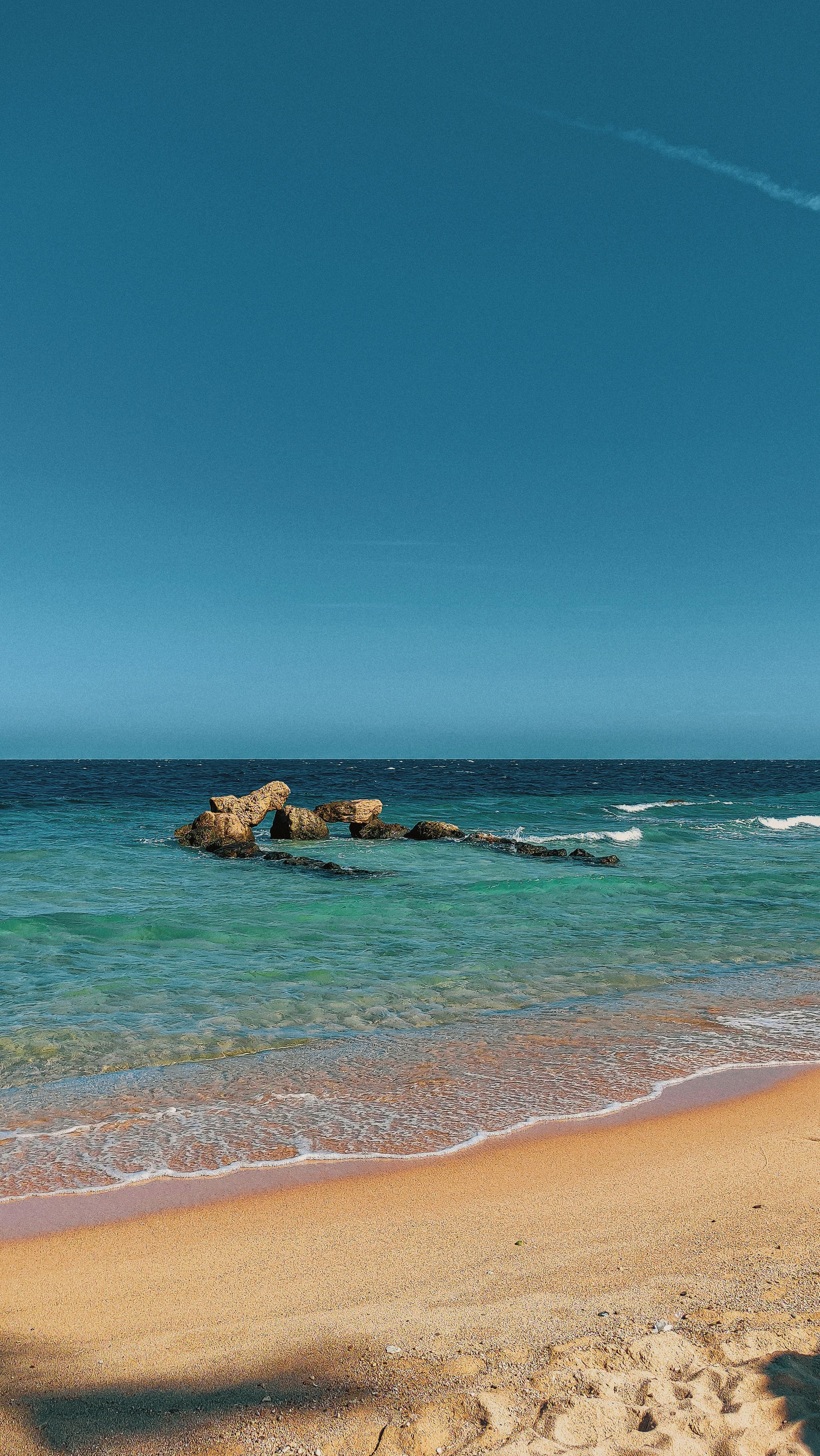 Gratis Scopri la tranquilla bellezza di una spiaggia egiziana con acque cristalline, perfetta per una vacanza estiva. Foto a disposizione