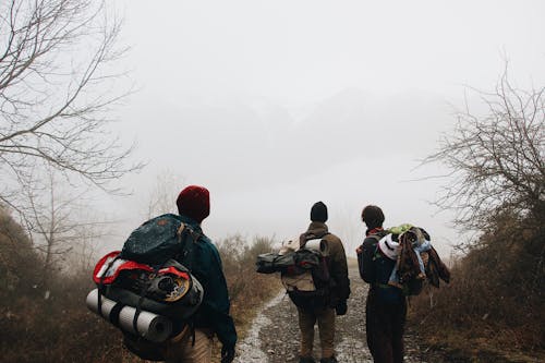 Free People Hiking On A Foggy Day Stock Photo