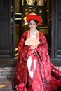 Traditional Asian Woman in Red Hanfu Sitting Indoors