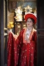 Young Woman in Traditional Red Vietnamese Attire