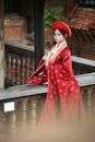 Elegant Woman in Traditional Red Attire Outdoors