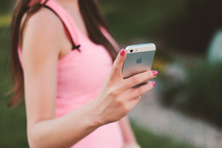 Woman Holding White Iphone 5