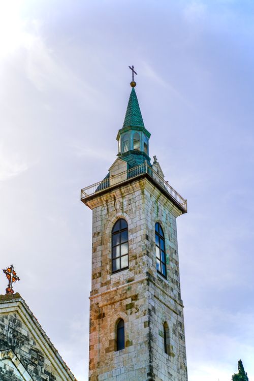 Free Stunning view of a historic church tower against a clear blue sky in Jerusalem. Stock Photo