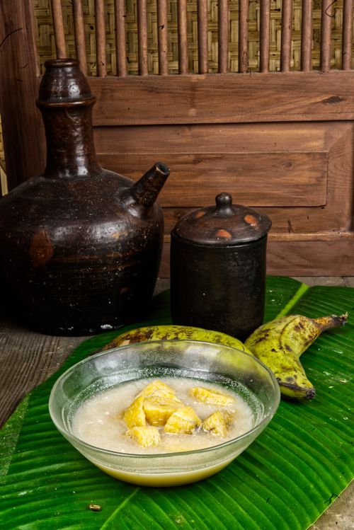 Free Delicious Indonesian Kolak served with fresh plantains on banana leaves, Surabaya style. Stock Photo
