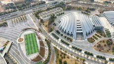 Aerial View of Modern Architecture and Soccer Field