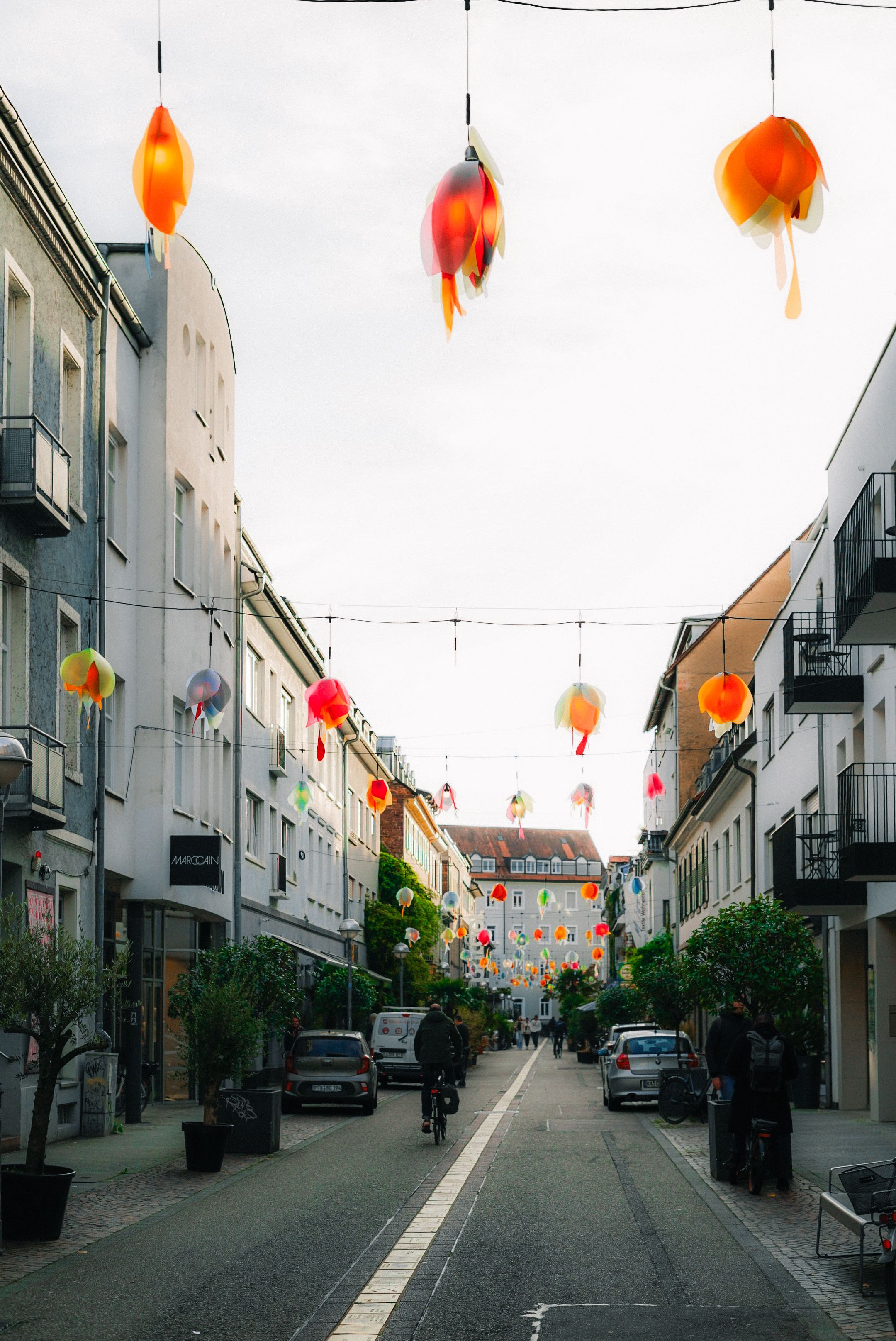Vibrant Street with Hanging Lanterns at Daytime · Free Stock Photo