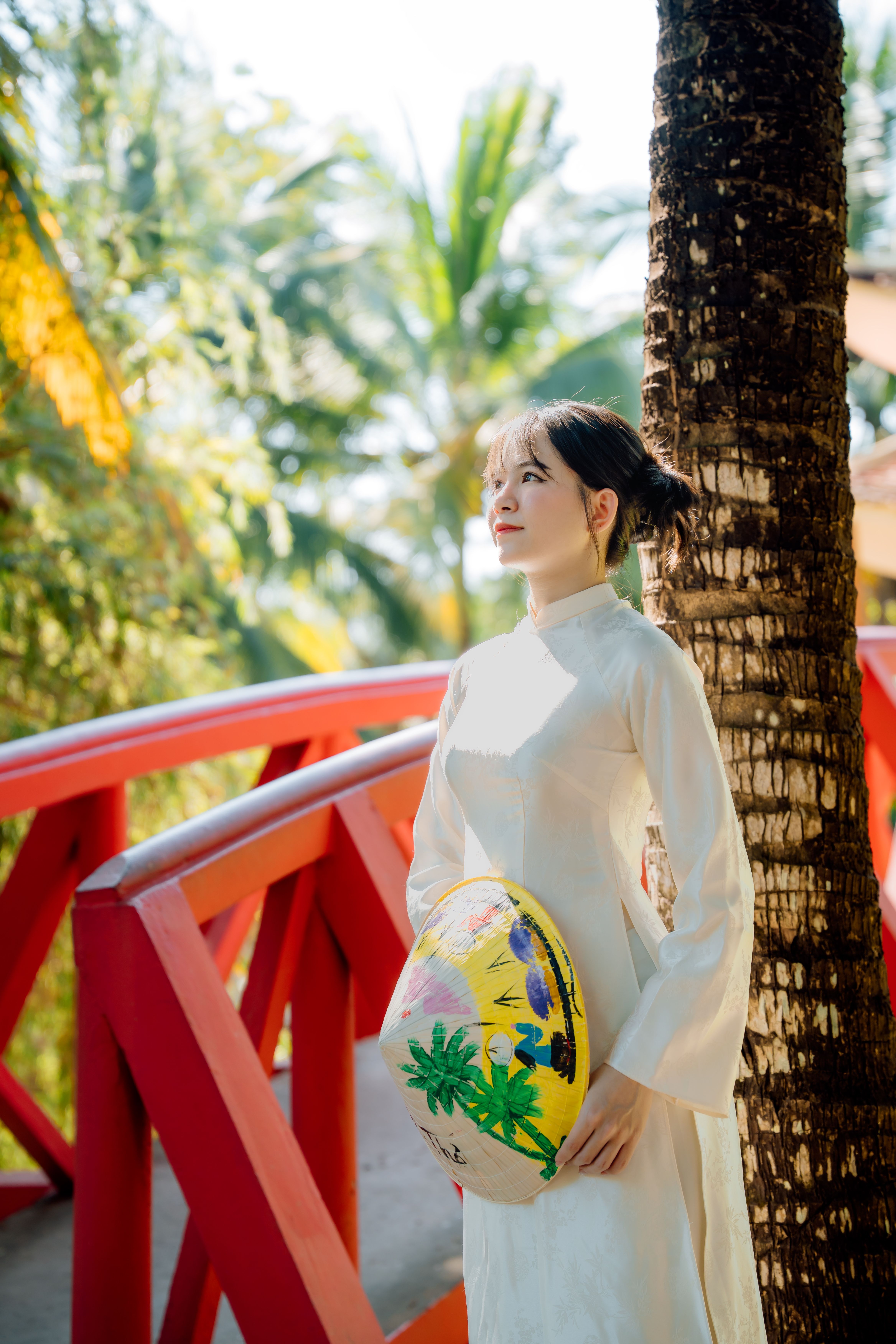 Woman in Traditional Dress on Vibrant Bridge · Free Stock Photo