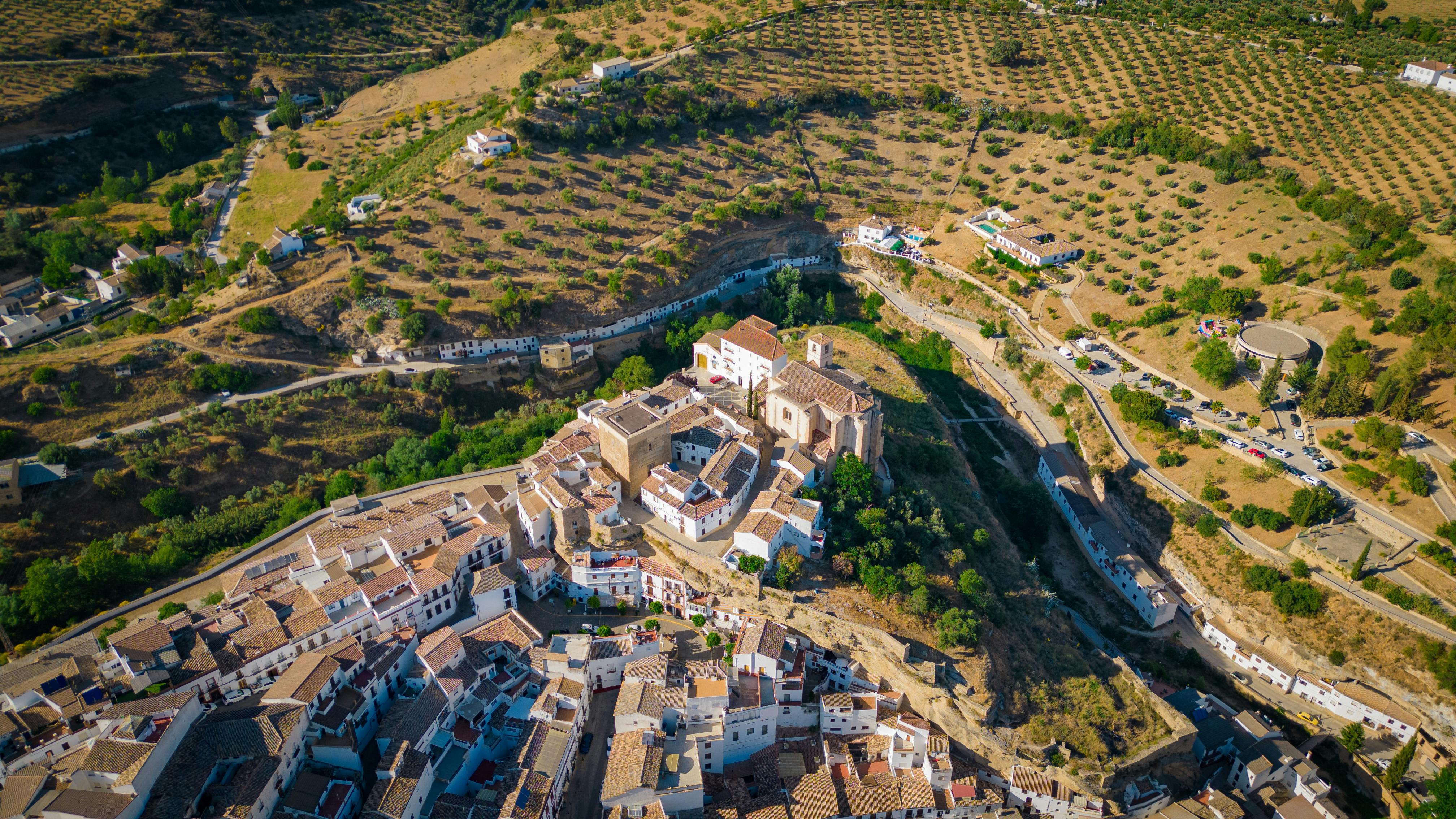 Cinematic aerial view of Setenil de las Bodegas showing unique town and landscape in Andalucía. - Setenil de las Bodegas