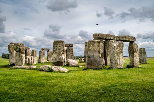 Free Breathtaking scene of Stonehenge captured under a dramatic cloudy sky, highlighting its ancient grandeur. Stock Photo