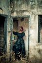 Woman in Elegant Dress in Abandoned Building