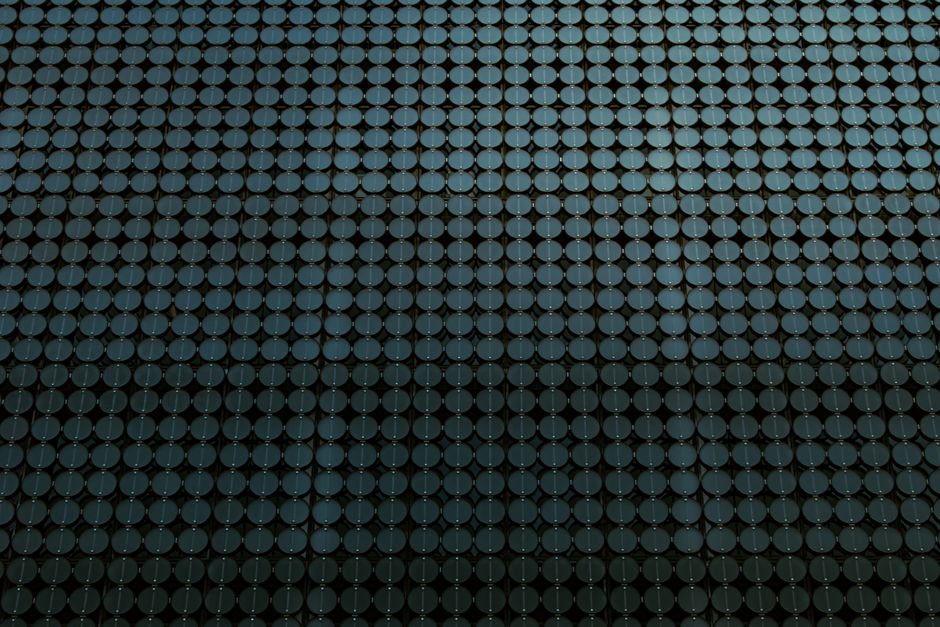 Close-up of a modern architectural facade featuring circular motifs in a geometric pattern.