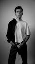 Black and White Portrait of Young Man in Photo Studio