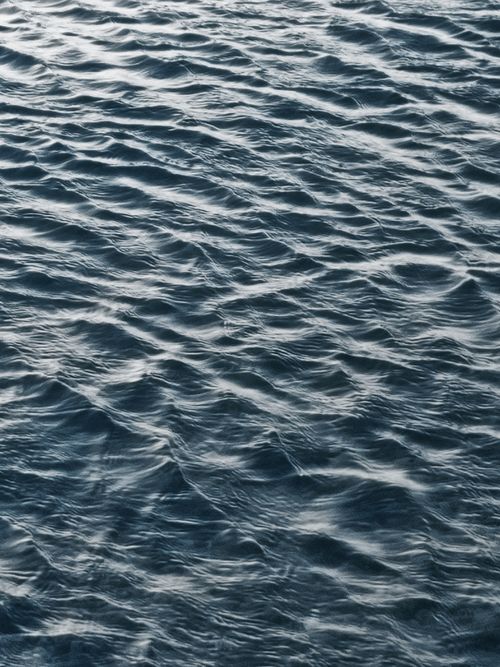 Free Soothing patterns of rippling ocean water under natural daylight. Stock Photo