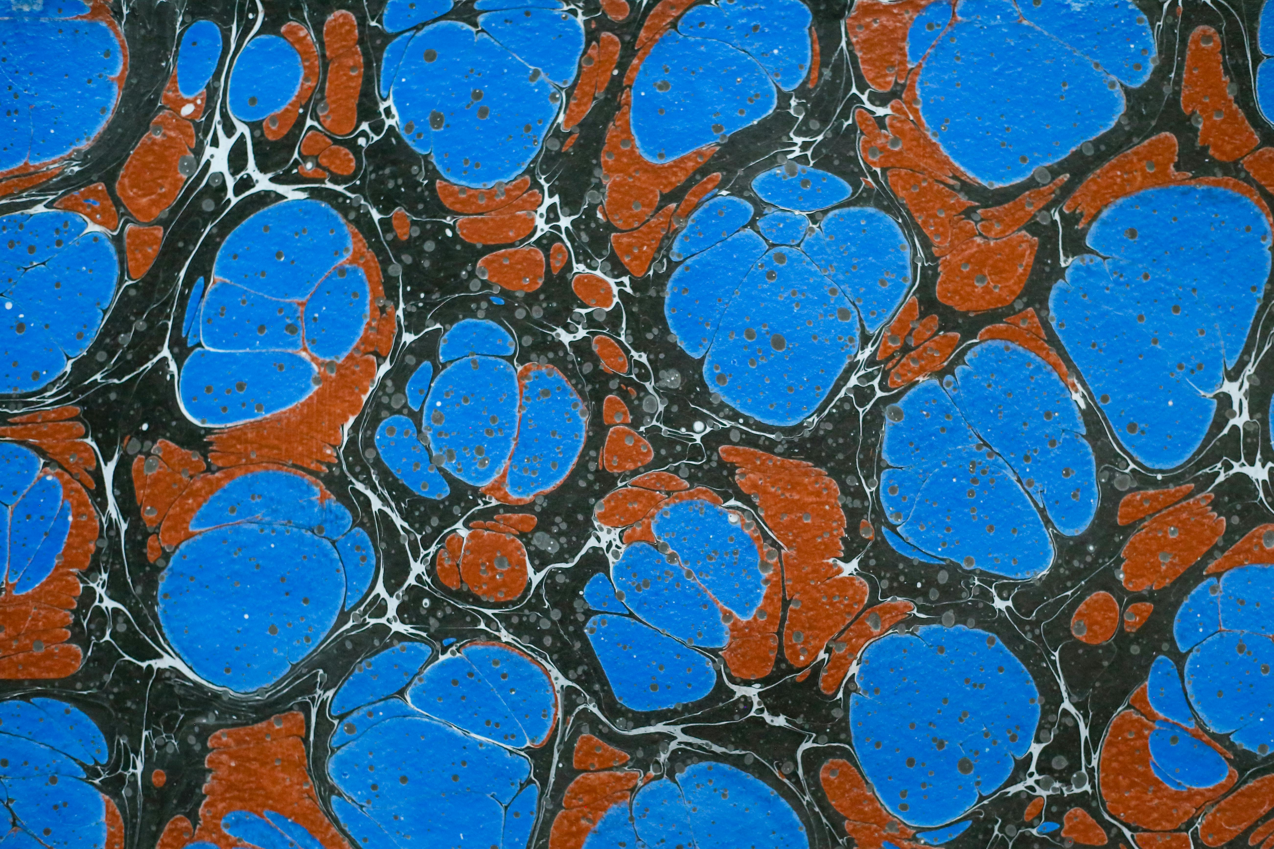 Gratis Vivido motivo astratto marmorizzato blu e arancione con forme fluide e texture intricate. Foto a disposizione