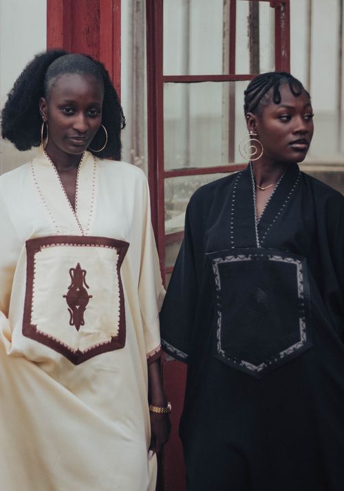 Free Elegant portrait of two women in traditional robes highlighting cultural fashion. Stock Photo